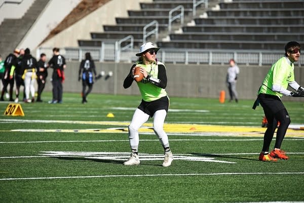 A person gets ready to throw a football