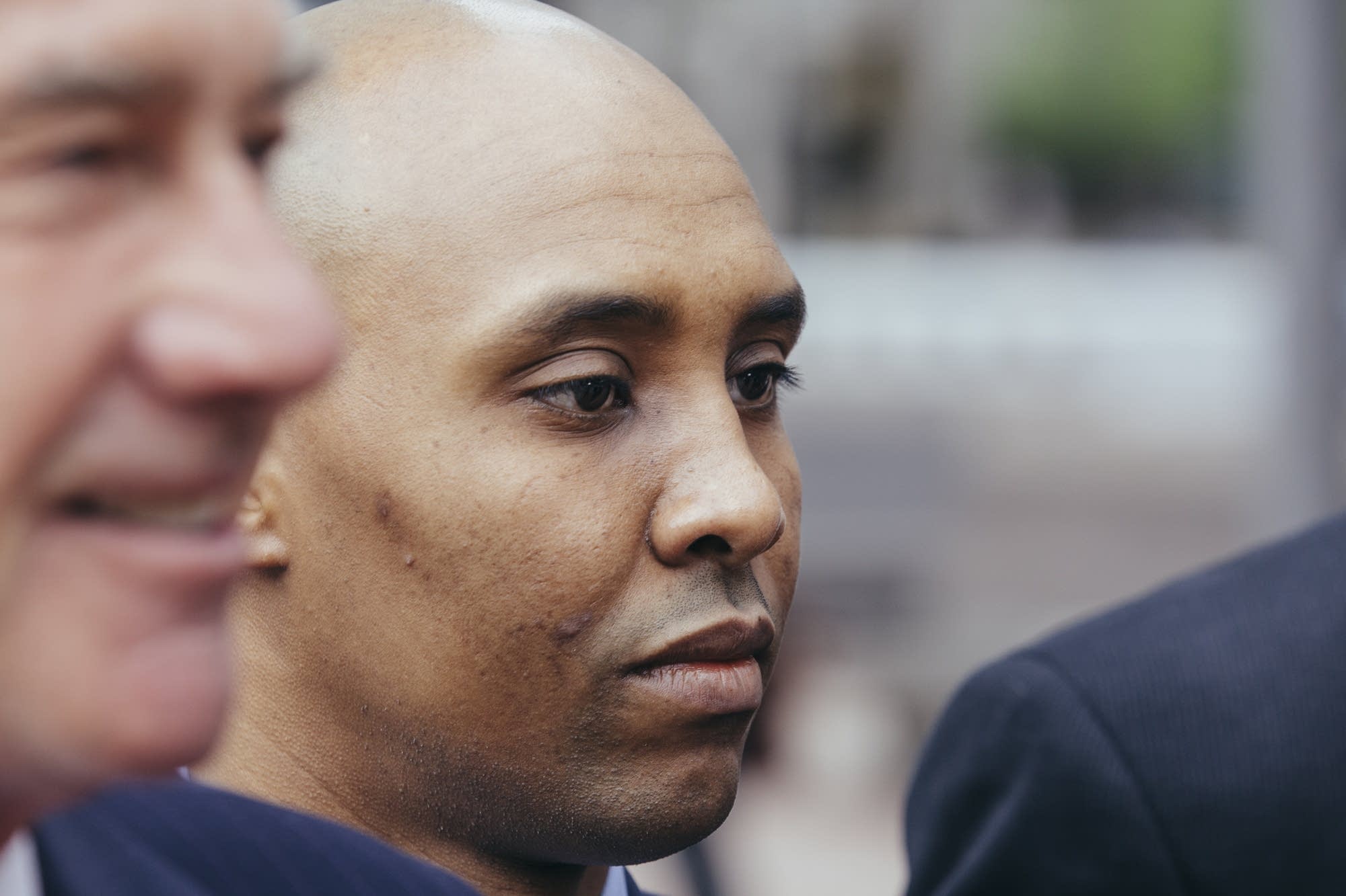 Mohamed Noor walks outside of the Hennepin County Government Center.
