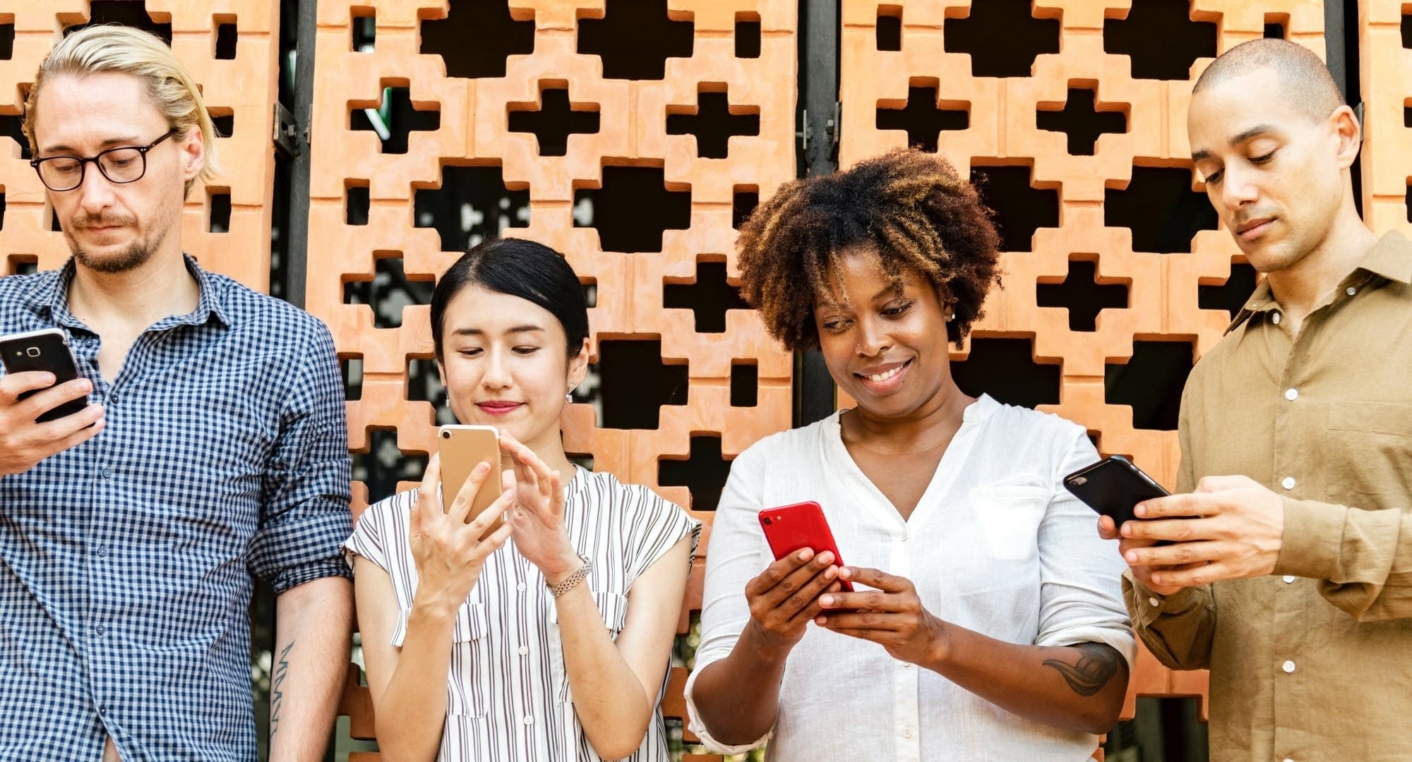4 people on their phones