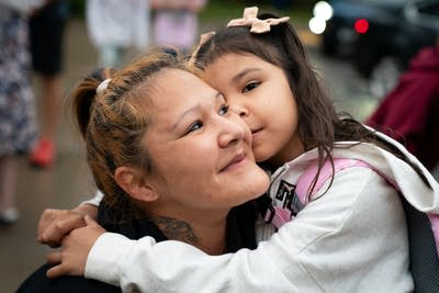 A child and parent hug