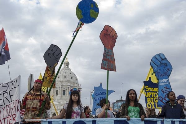 Anti-pipeline protestors march away from the Capitol on Thursday.