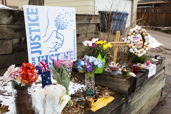 A fresh memorial for Justine Ruszczyk sits at the end of the alley