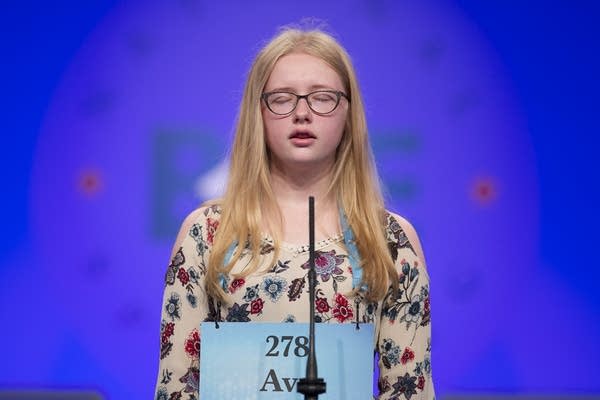Ava Becken, 14, from Faribault, Minn., spells her word correctly.