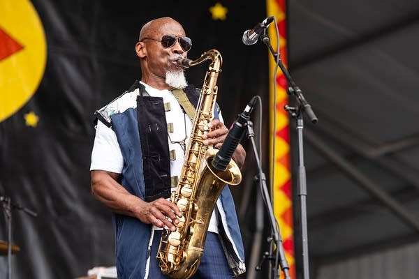 Karl Denson playing saxophone on stage