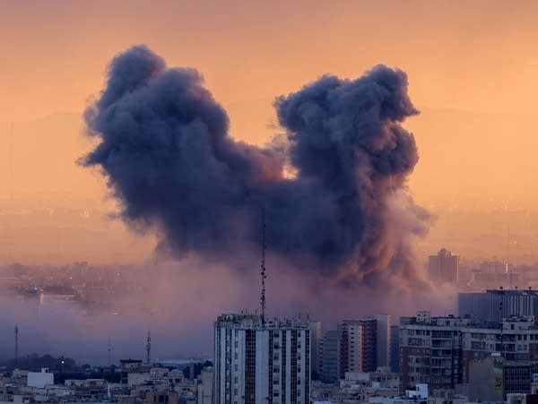 A plume of smoke rises after a strike on the Iranian capital Tehran.