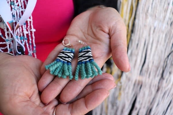 Two earrings.