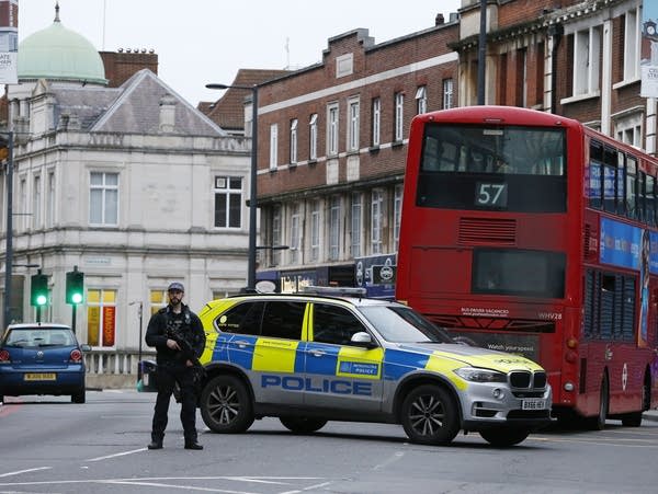 A police officer stands guard near the scene