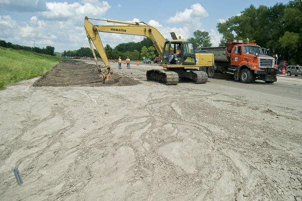 Removing silt along Highway 169