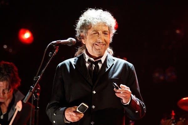 Bob Dylan performing on stage