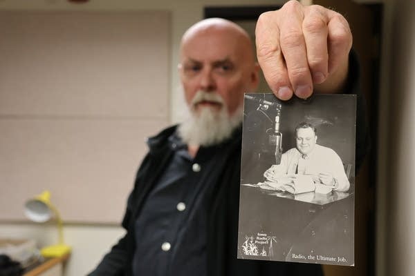Dan holding radio card