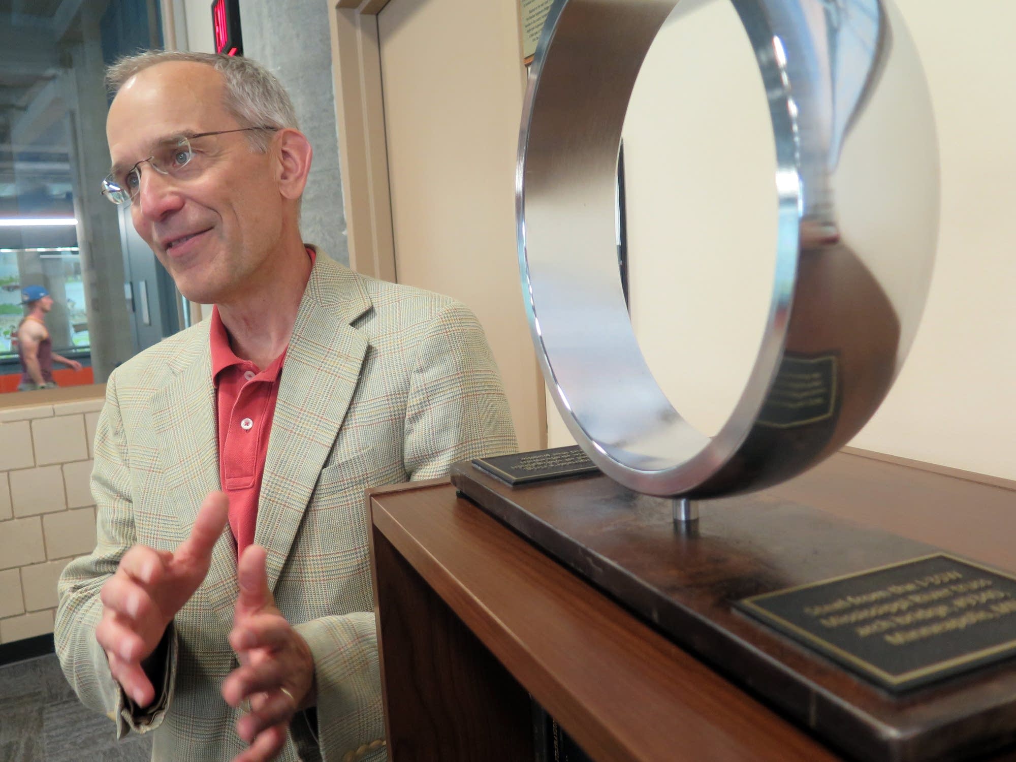 U of M engineering prof. Joe Labuz with a ring from I-35W bridge remnants.