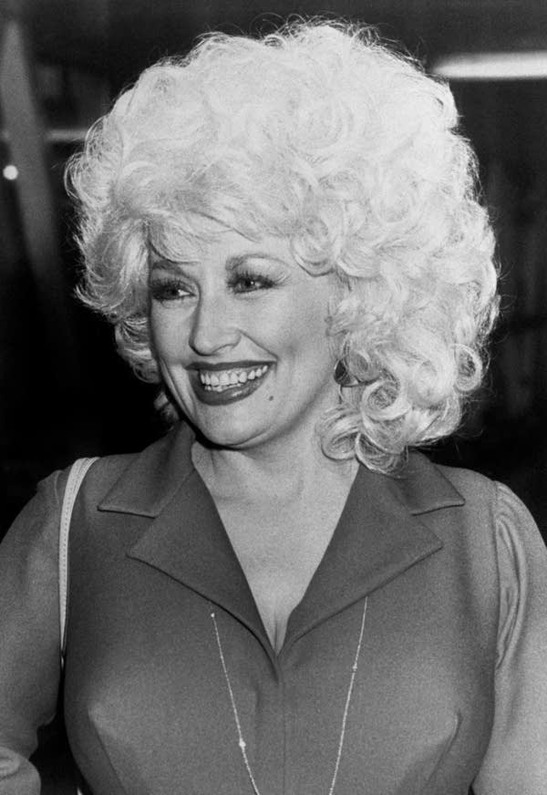 Portrait taken on September 12, 1983 in Paris shows US singer Dolly Parton. Parton began her career in 1967 with Hello, I'm Dolly. Described as a "country legend", Parton has sold more than 100 million records worldwide, making her one of the best-selling music artists of all time. (Photo by AFP) (Photo by -/AFP via Getty Images)