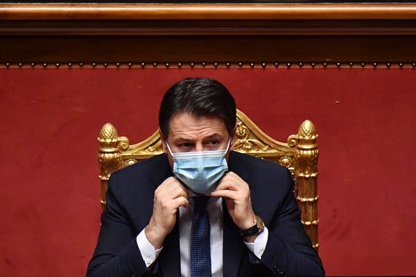 Italy's prime minister is stepping down but not handing over the keys to government just yet.