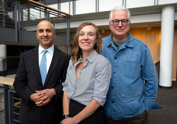 three people posing for a portrait