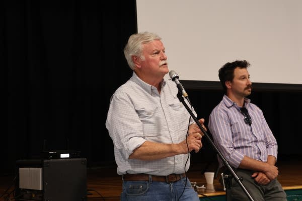 A man speaks into a microphone