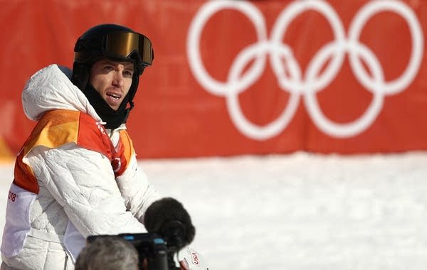 Shaun White waits to see results from his qualification run on halfpipe