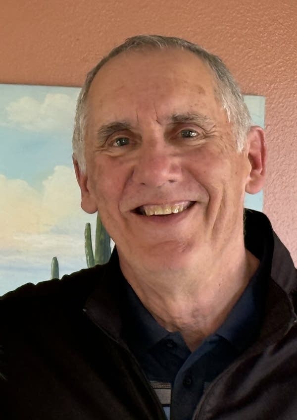 man smiling in headshot