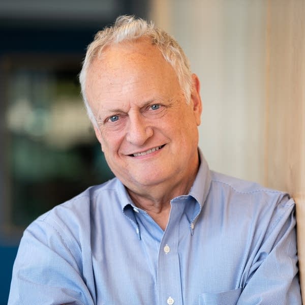 A man poses for a photograph.
