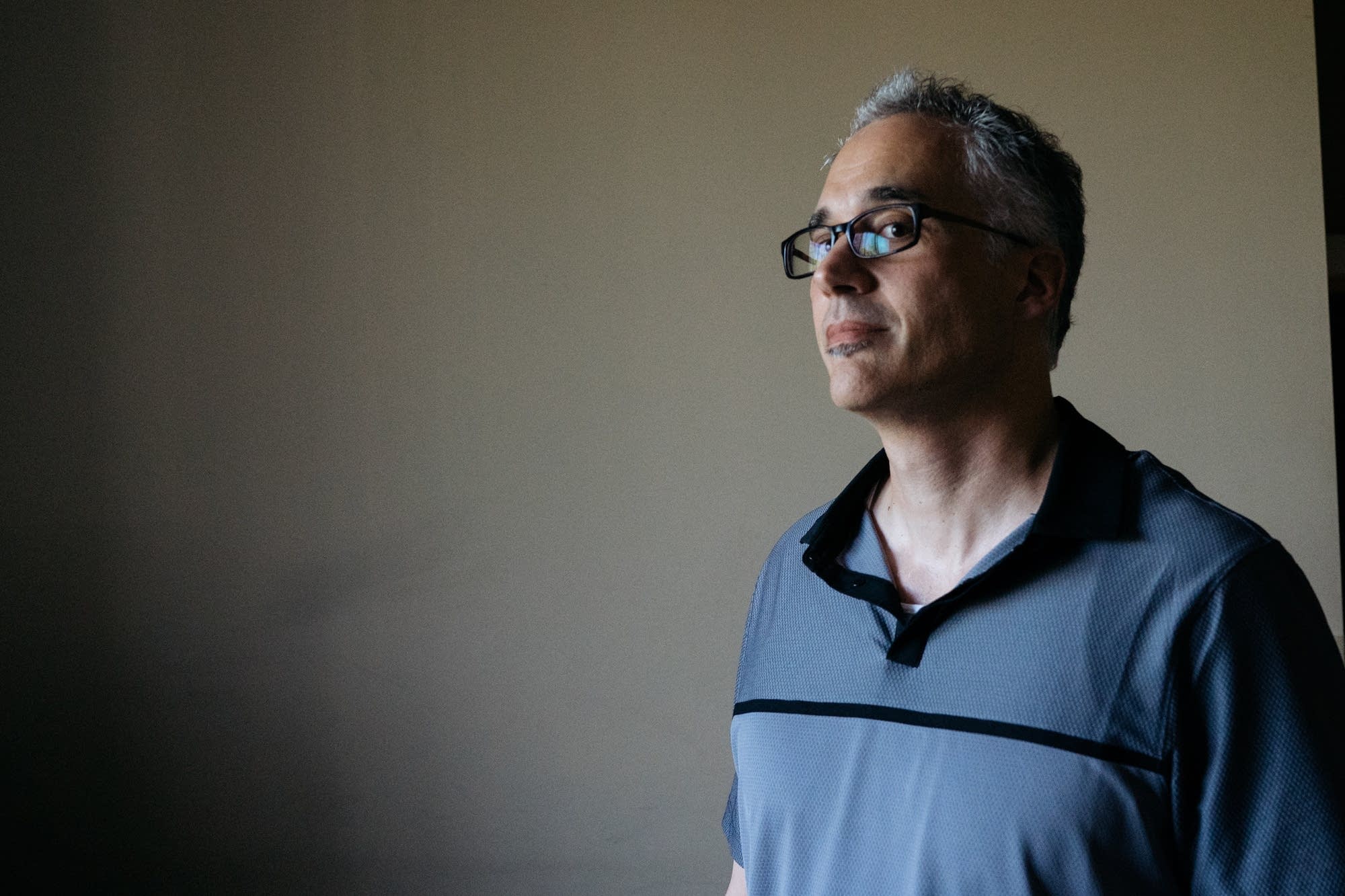 Mike Mitchelson stands for a portrait.