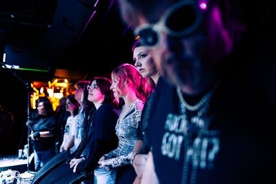 Music fans watching a band in a small venue