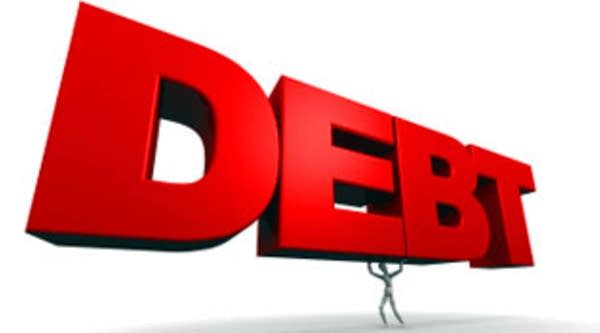 Mannequin holding red word Debt