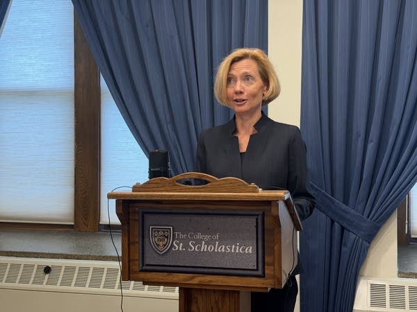 A woman talking at a podium