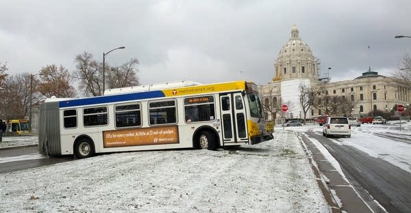 Bus astraddle street near Capitol