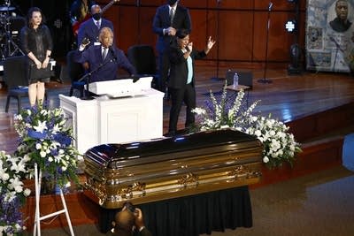 Man speaking at a memorial