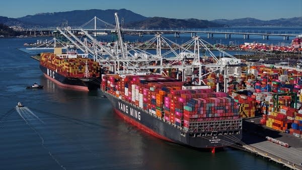 Container ships carrying foreign goods docked at the Port of Oakland in December. 