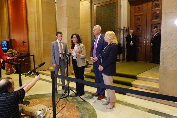 four lawmakers speaking to press at capitol
