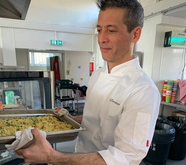 Dorchester chef Michey Chan serves up lunch at Manorfield Primary School in London.