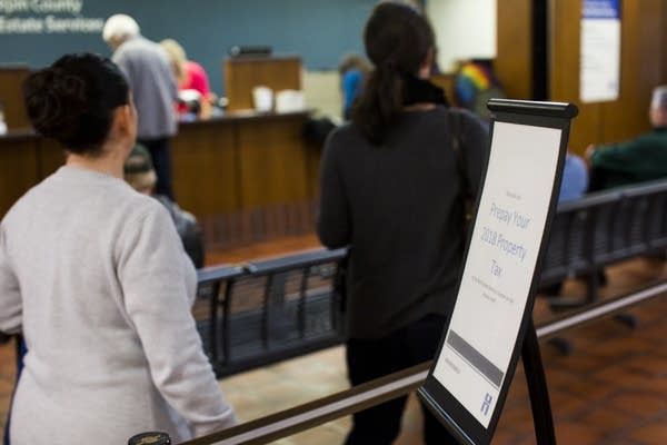 A sign tells people where to prepay their 2018 property taxes.