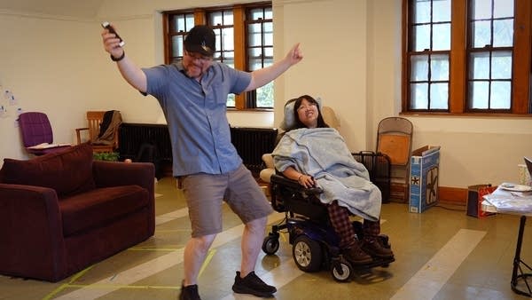 Two people perform in rehearsal.