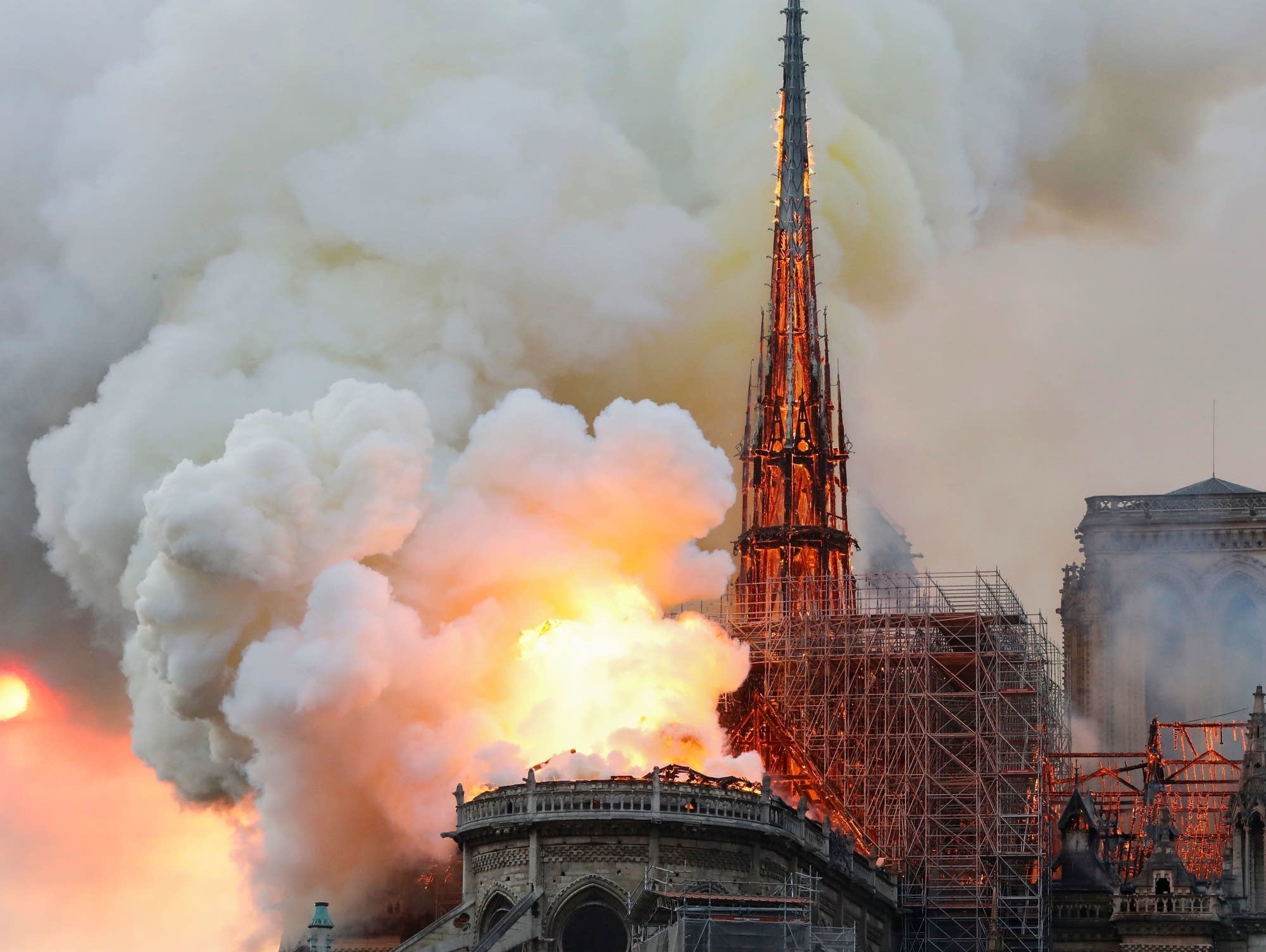Smoke and flames rise during a fire at the landmark Notre-Dame Cathedral.