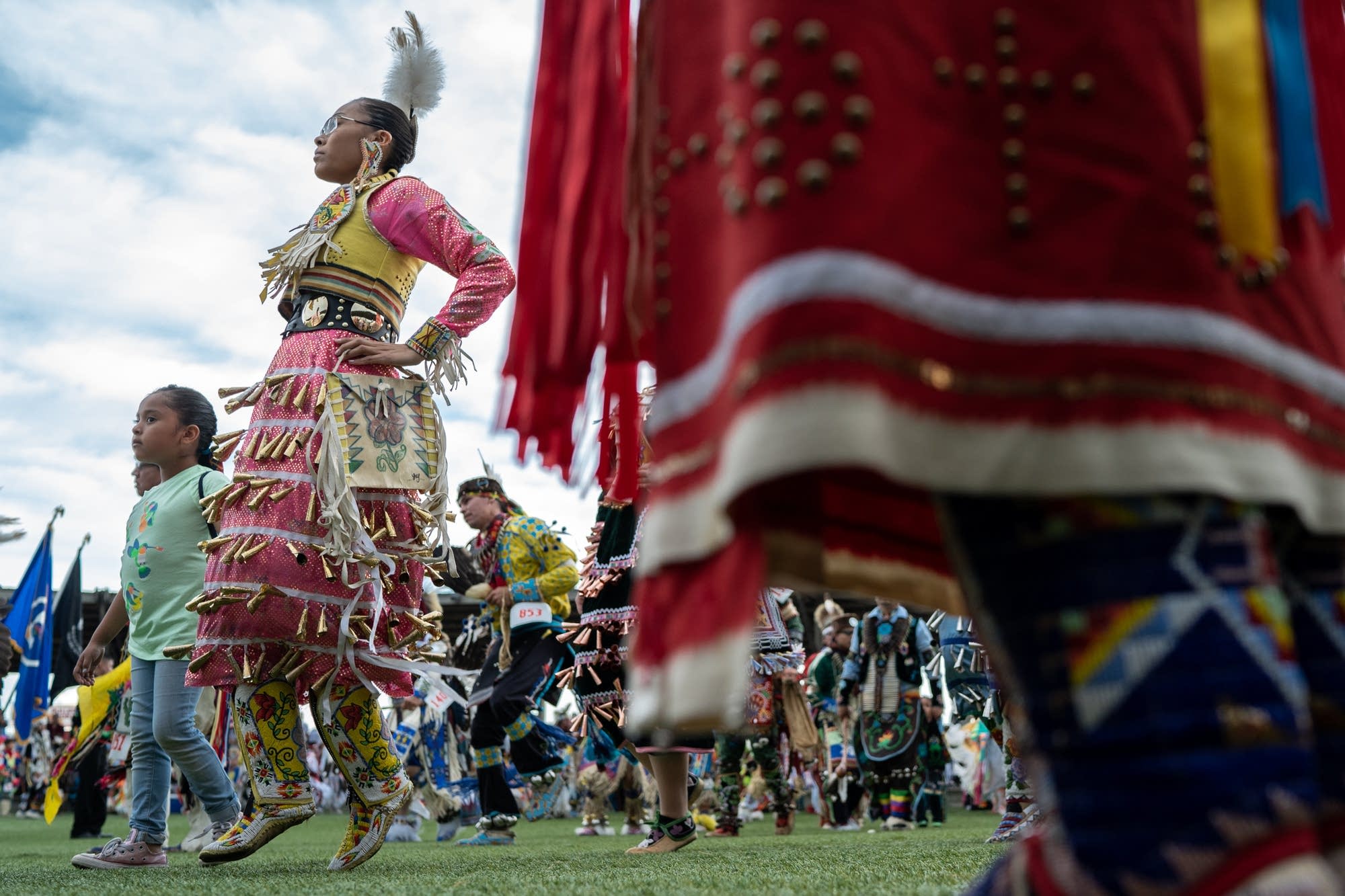 The Jingles Dress dancers surround the powwow grounds of the Grand Hinckley Casino.