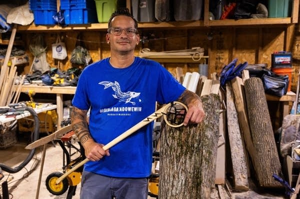 man posing for portrait with stickball
