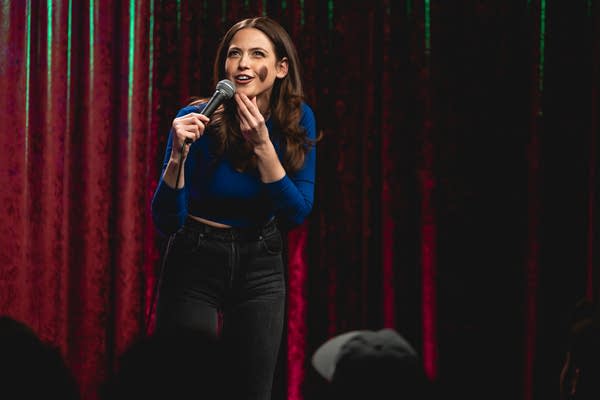 A woman performs on stage