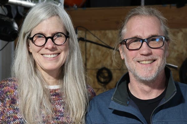 A man and a woman pose for a photo.