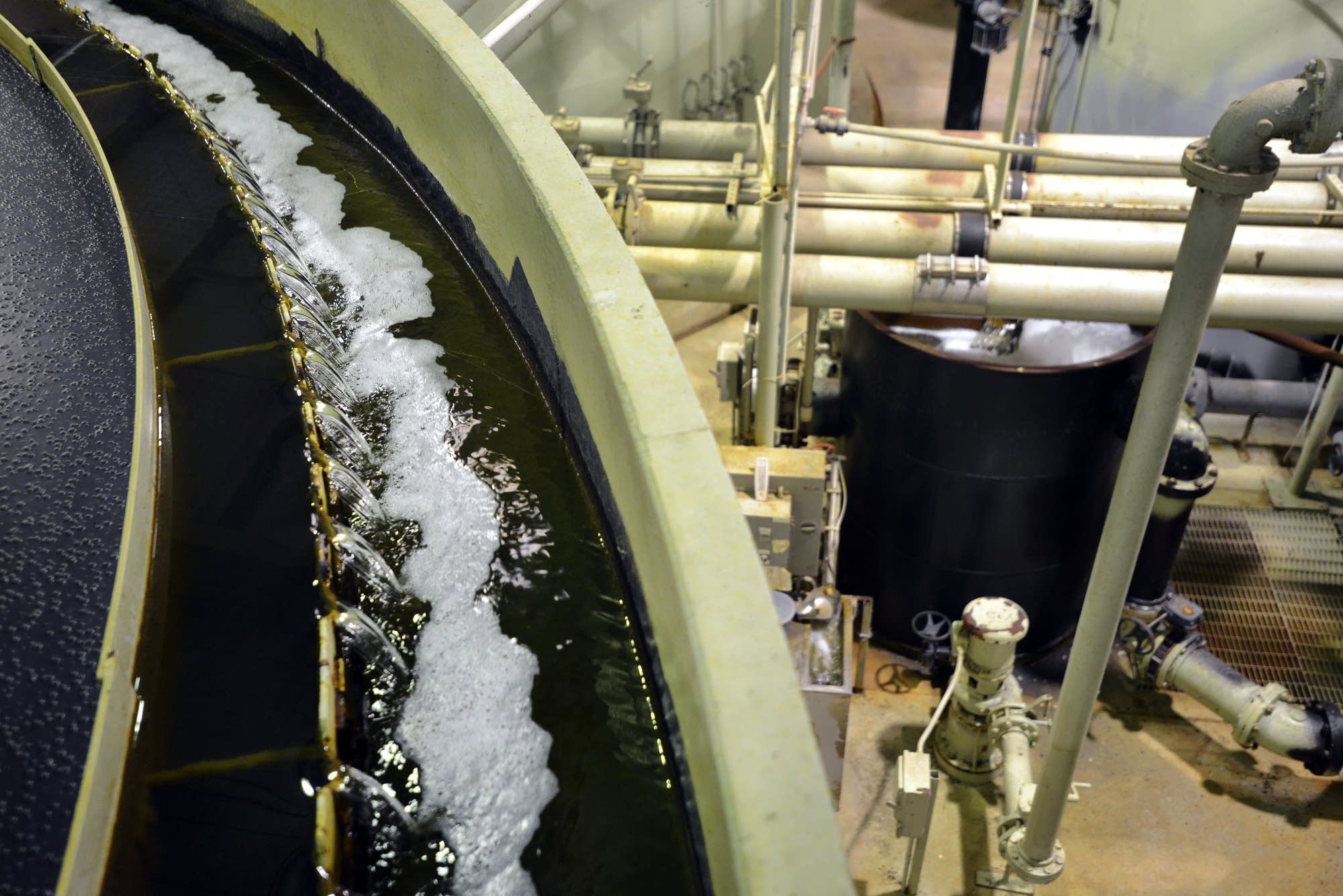 Water flows through a settling tank during the last stages of treatment.