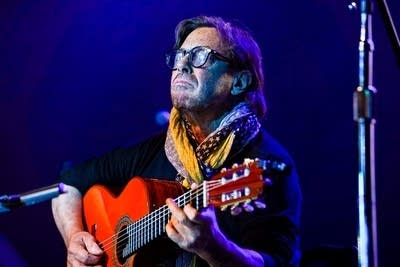Al Di Meola performing on stage