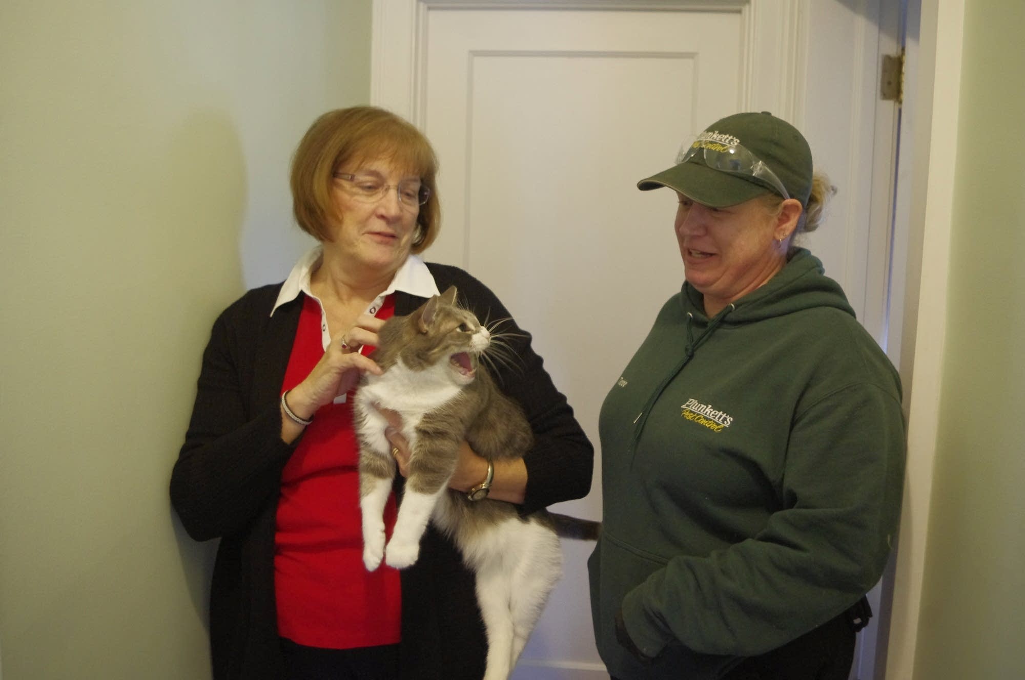 Homeowner Kathy Manderscheid and pest control technician Tedde Zumwalt