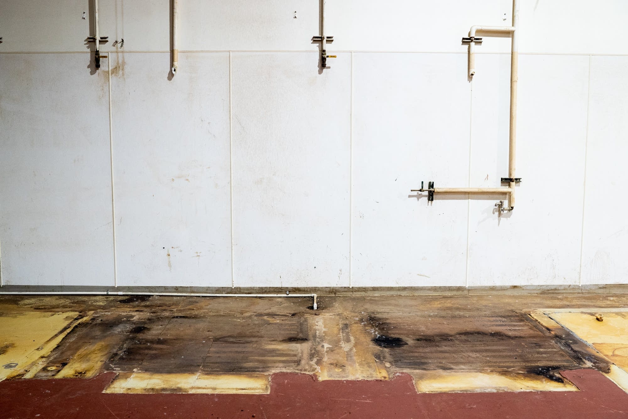 Burnt floor space and utility connections remain.