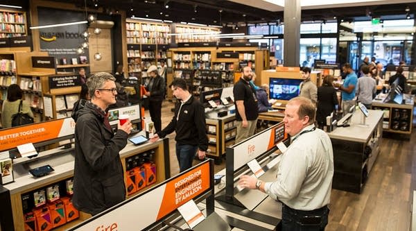 Customers browse books and other Amazon products at the newly-opened Amazon Books store on November 4, 2015 in Seattle, Washington.
 