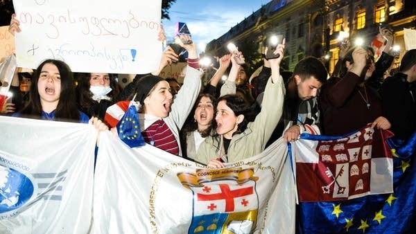Students march toward the Georgian Parliament Building protesting against the "foreign agent bill" on Monday in Tbilisi, Georgia.