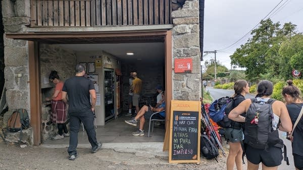 Pilgrims on the Camino de Santiago support small businesses all along the trail, including vending machines that some residents set up in their garages to offer a quick snack.
