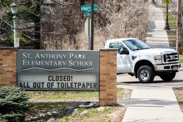 A sign says a school is closed.