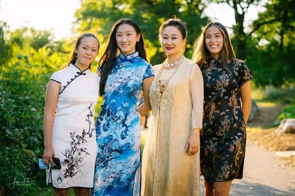 People pose in Chinese clothing