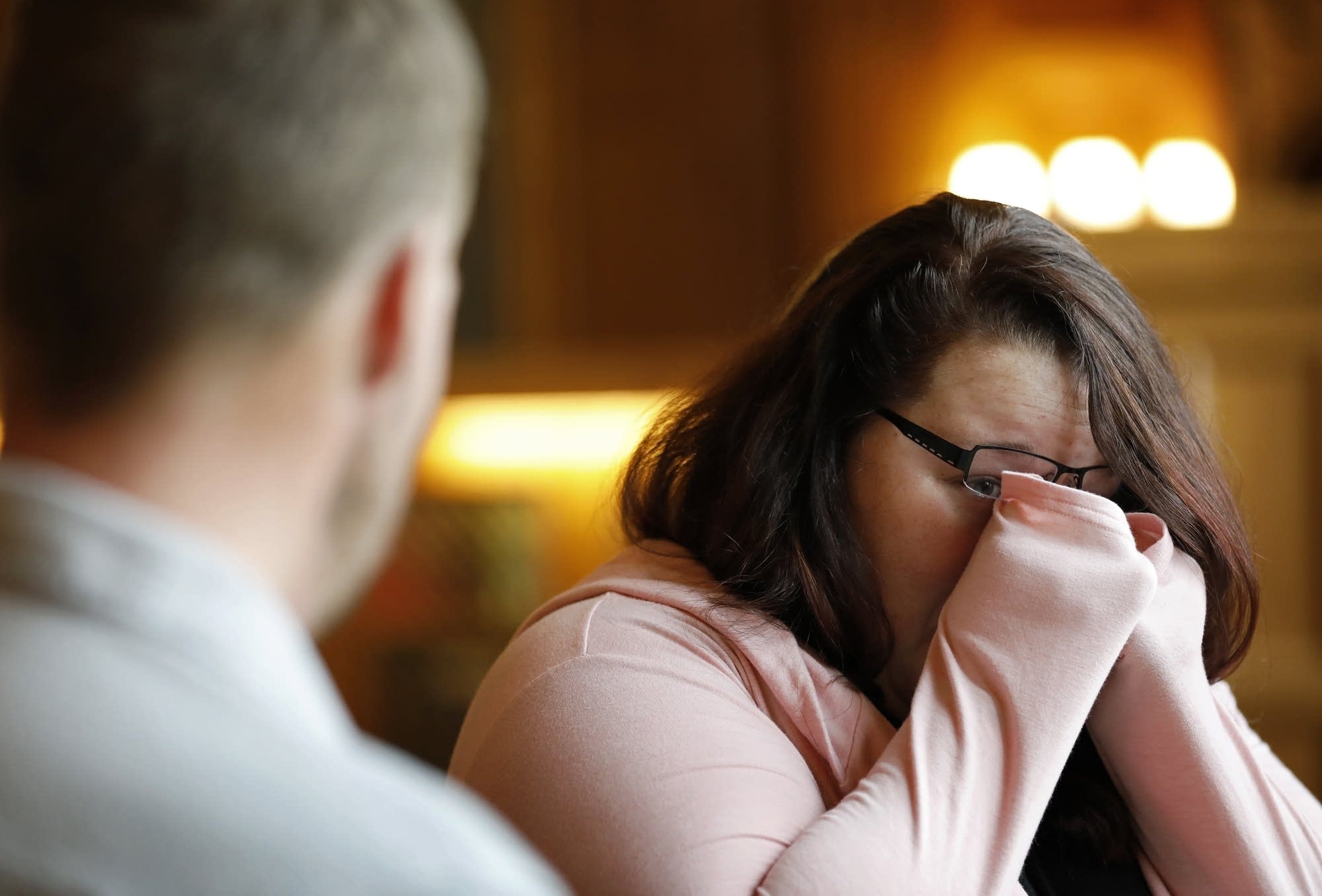 Lilly Ross reacts as she talks with Andy Sandness.