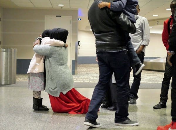 Muha Yasin hugged her daughter after she and her brother arrived.