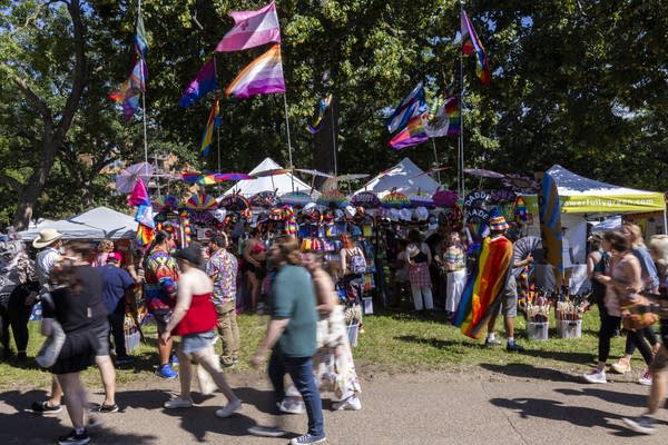 A booth sells pride-themed fans and flags at Twin Cities Pride on Saturday, June 27, 2026.